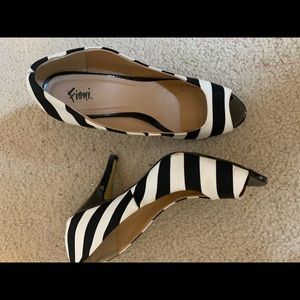 Black and white striped pumps